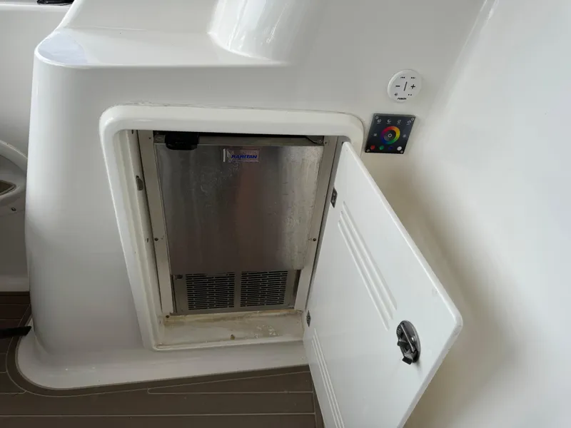 Slide: The Image of 2006 Silverton 43 Sport Bridge yacht interior with open storage compartment. - 10