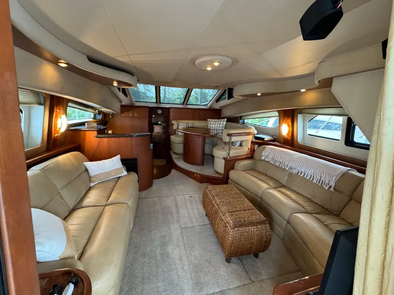 Slide: The Image of Luxurious interior of a 2006 Silverton 43 Sport Bridge yacht with leather seating and elegant decor. - 13