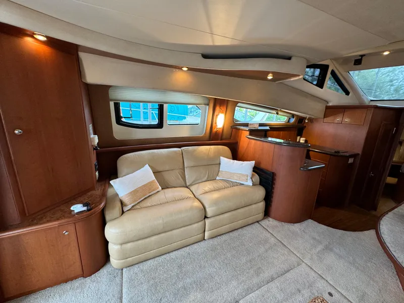 Slide: The Image of Luxurious interior of 2006 Silverton 43 Sport Bridge yacht with beige leather sofa. - 17
