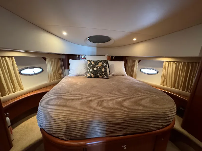 Slide: The Image of Luxurious cabin interior of 2006 Silverton 43 Sport Bridge yacht with cozy bedding. - 23