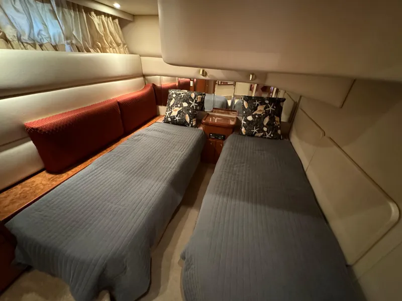 Slide: The Image of Interior of 2006 Silverton 43 Sport Bridge with twin beds and elegant decor. - 29