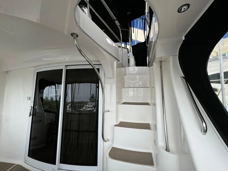 Slide: The Image of Staircase on 2006 Silverton 43 Sport Bridge yacht with sleek design and modern interior. - 35