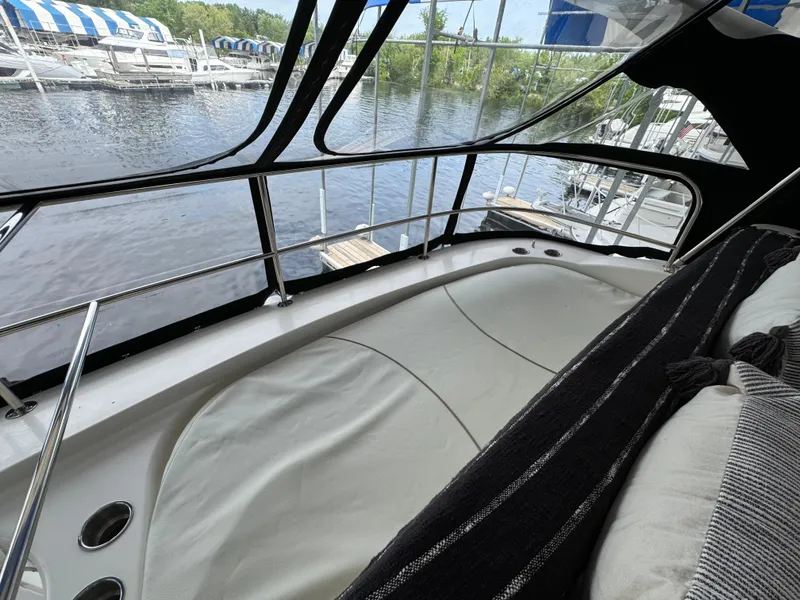 Slide: The Image of 2006 Silverton 43 Sport Bridge yacht interior with water view and comfortable seating. - 38