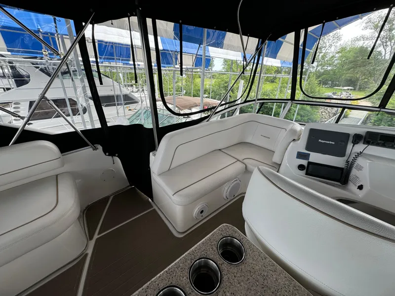 Slide: The Image of Interior view of 2006 Silverton 43 Sport Bridge yacht with seating and navigation equipment. - 41