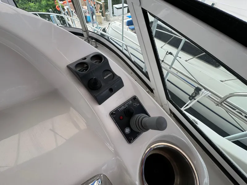 Slide: The Image of Control panel of a 2006 Silverton 43 Sport Bridge yacht, featuring a thruster joystick. - 44