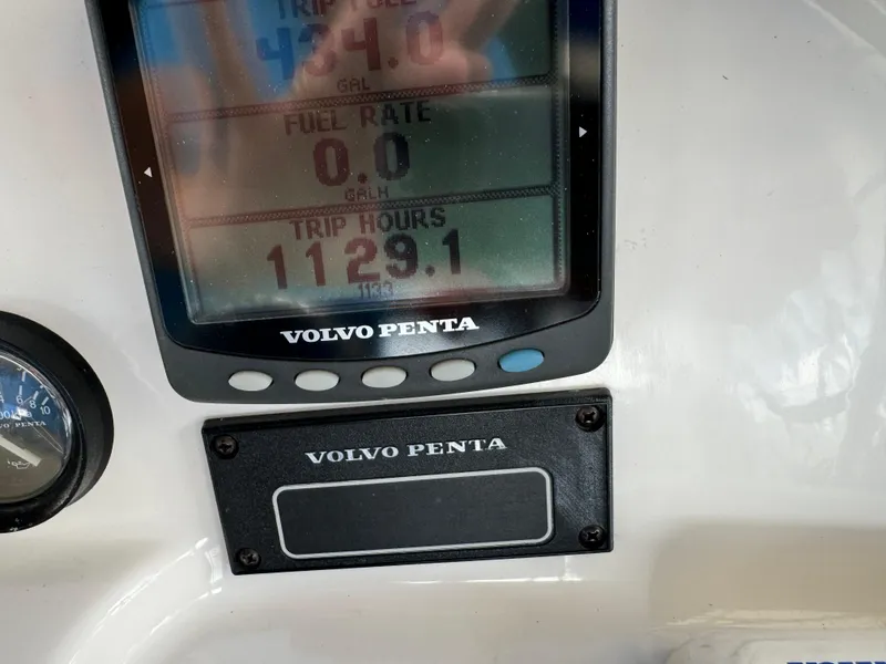 Slide: The Image of Volvo Penta display on 2006 Silverton 43 Sport Bridge showing trip data and fuel rate. - 45