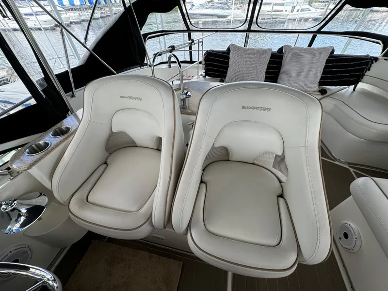 Slide: The Image of 2006 Silverton 43 Sport Bridge interior with plush seating and modern design. - 47