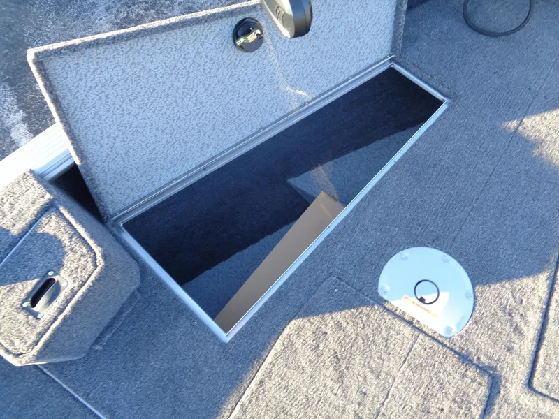 Slide: The Image of Open storage compartment on a 2025 Lund 1875 Pro Guide boat deck. - 10