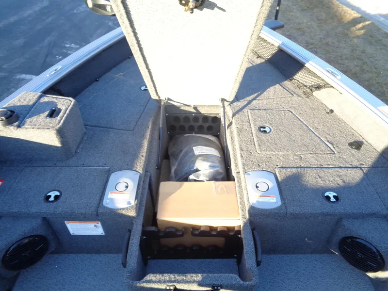 Slide: The Image of 2025 Lund 1875 Pro Guide boat storage compartments with open hatch, showcasing interior space. - 21
