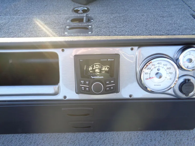 Slide: The Image of Dashboard of 2025 Lund 1875 Pro Guide boat with speedometer and control panel. - 25