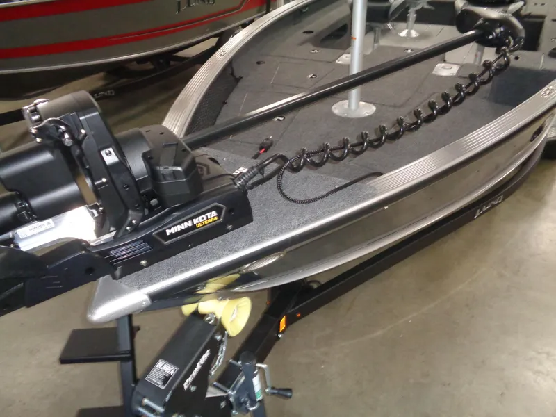 Slide: The Image of 2025 Lund 1875 Pro Guide boat with Minn Kota Ulterra trolling motor on display. - 27