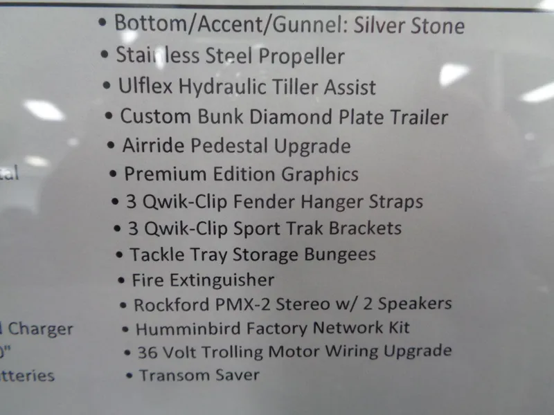 Slide: The Image of 2025 Lund 1875 Pro Guide features list with premium upgrades and accessories. - 38