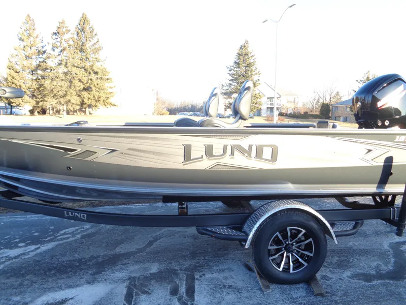Slide: The Image of 2025 Lund 1875 Pro Guide boat on trailer, side view. - 5