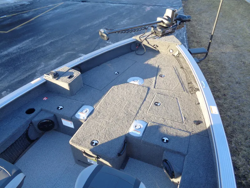 Slide: The Image of 2025 Lund 1875 Pro Guide boat interior with fishing deck and trolling motor. - 9