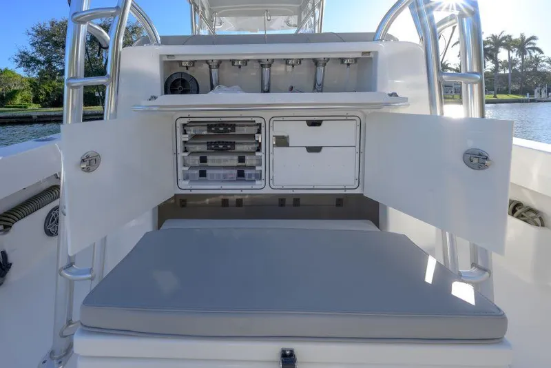 Slide: The Image of 2022 SeaVee 390Z boat with open storage compartments and seating area. - 10