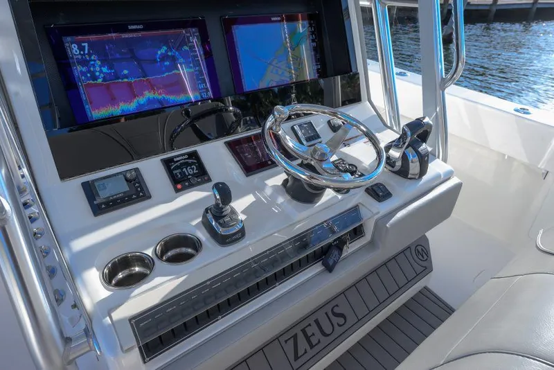 Slide: The Image of 2022 SeaVee 390Z boat dashboard with advanced navigation and control systems. - 17