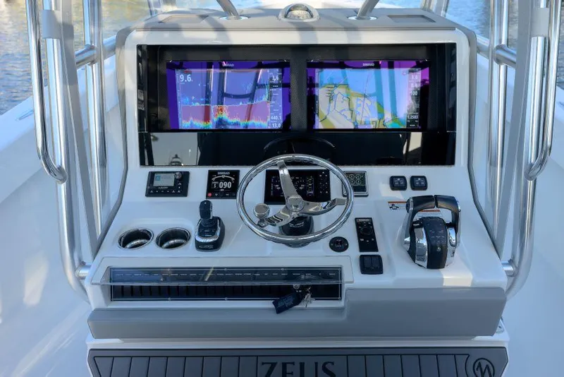 Slide: The Image of 2022 SeaVee 390Z helm with dual navigation screens and modern controls. - 18