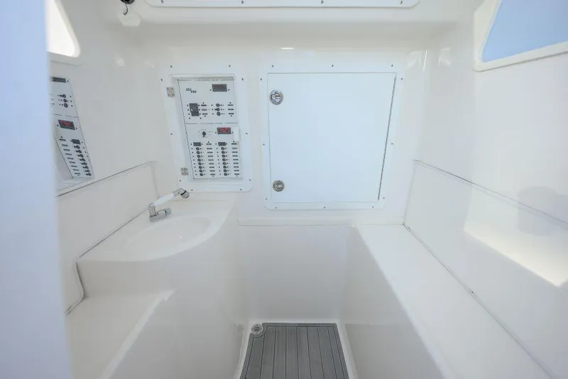 Slide: The Image of 2022 SeaVee 390Z interior with control panels and storage compartment. - 23