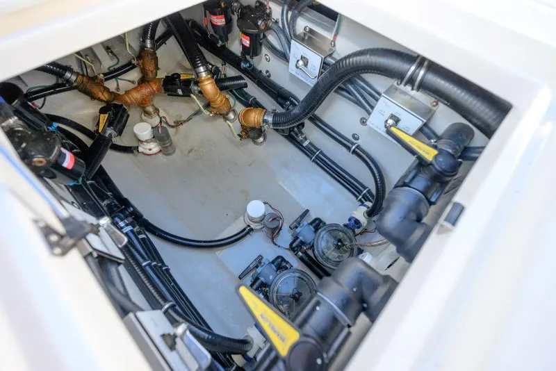 Slide: The Image of 2022 SeaVee 390Z boat engine compartment with visible wiring and components. - 26