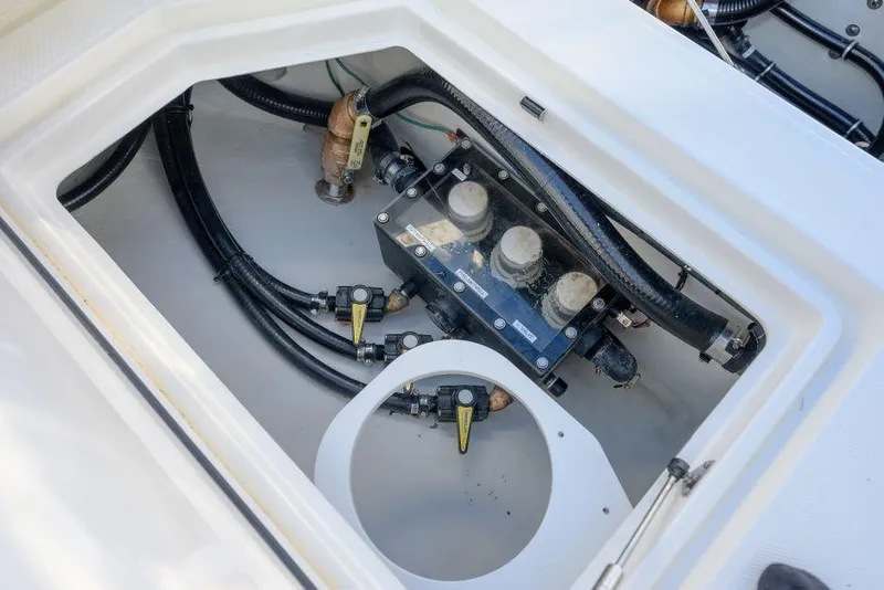 Slide: The Image of 2022 SeaVee 390Z boat compartment with wiring and valves. - 27