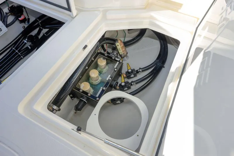 Slide: The Image of 2022 SeaVee 390Z boat compartment with visible wiring and components. - 28