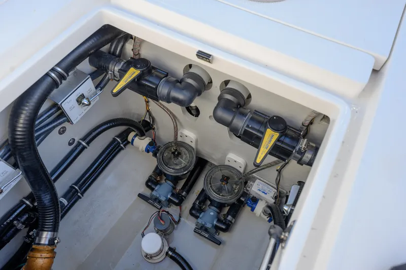 Slide: The Image of 2022 SeaVee 390Z boat plumbing system with valves and hoses. - 29