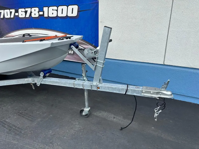Slide: The Image of Trailer for Veer V13 boat, 2023 model, parked on pavement. - 4