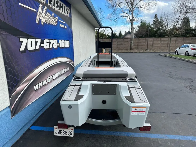 Slide: The Image of 2023 Veer V13 boat parked outside GFM Marine, showcasing rear design. - 8