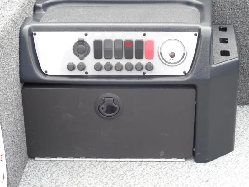 Slide: The Image of Control panel of 2025 Lund 1650 Rebel XL Tiller boat, featuring switches and dials. - 14
