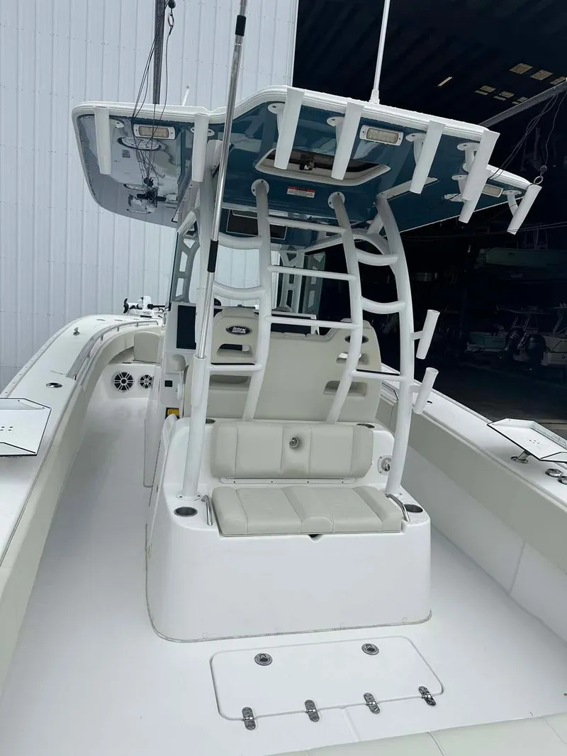 Slide: The Image of 2022 Cape Horn 36 XS boat with T-top and seating, docked indoors. - 14