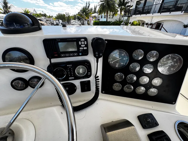 Slide: The Image of 1991 Tiara Yachts 3600 Convertible dashboard with gauges and controls. - 11