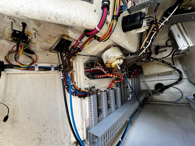 Slide: The Image of Engine room wiring of 1991 Tiara Yachts 3600 Convertible, showcasing cables and components. - 13