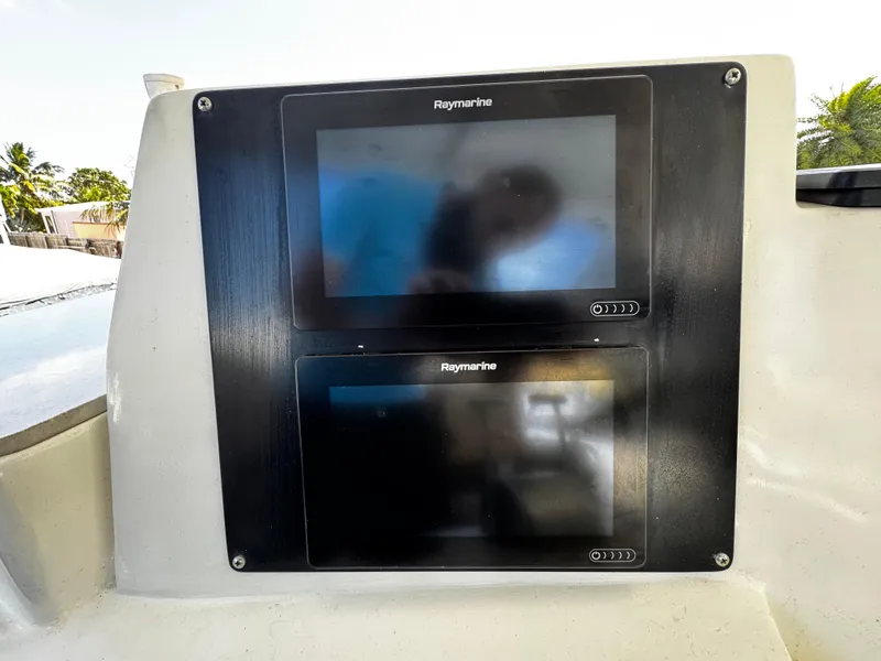 Slide: The Image of Raymarine displays on 1991 Tiara Yachts 3600 Convertible dashboard. - 15