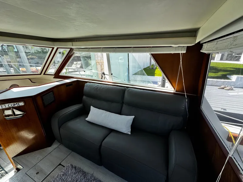 Slide: The Image of Interior of 1991 Tiara Yachts 3600 Convertible with leather seating and panoramic windows. - 23
