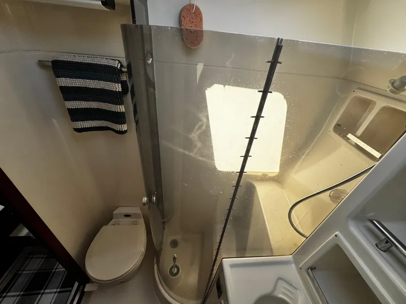 Slide: The Image of Bathroom interior of 1991 Tiara Yachts 3600 Convertible with shower and toilet. - 34