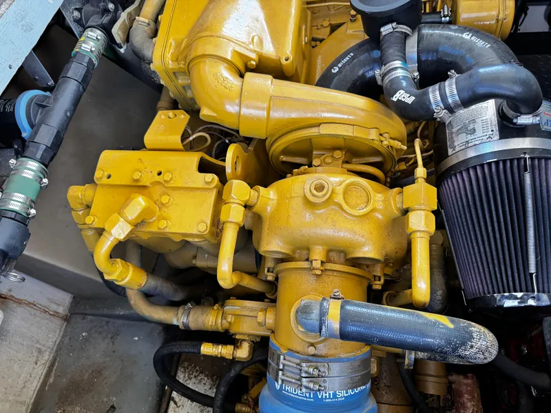 Slide: The Image of Engine of a 1991 Tiara Yachts 3600 Convertible, showcasing yellow components and hoses. - 39
