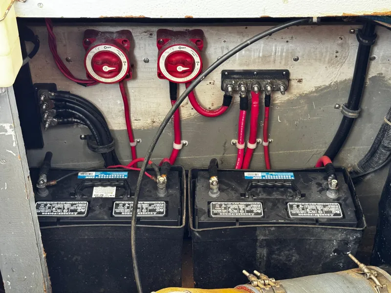 Slide: The Image of Battery compartment of 1991 Tiara Yachts 3600 Convertible with wiring and switches. - 43