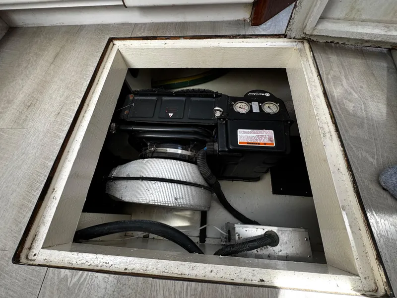 Slide: The Image of Engine compartment of a 1991 Tiara Yachts 3600 Convertible, showcasing mechanical components. - 44