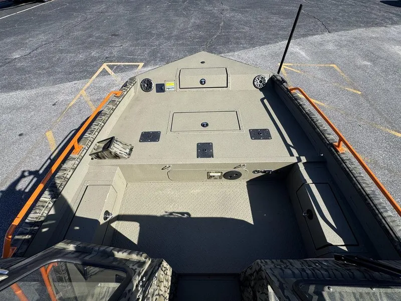 Slide: The Image of 2025 SeaArk ProCat 240 boat deck with storage compartments and seating. - 15