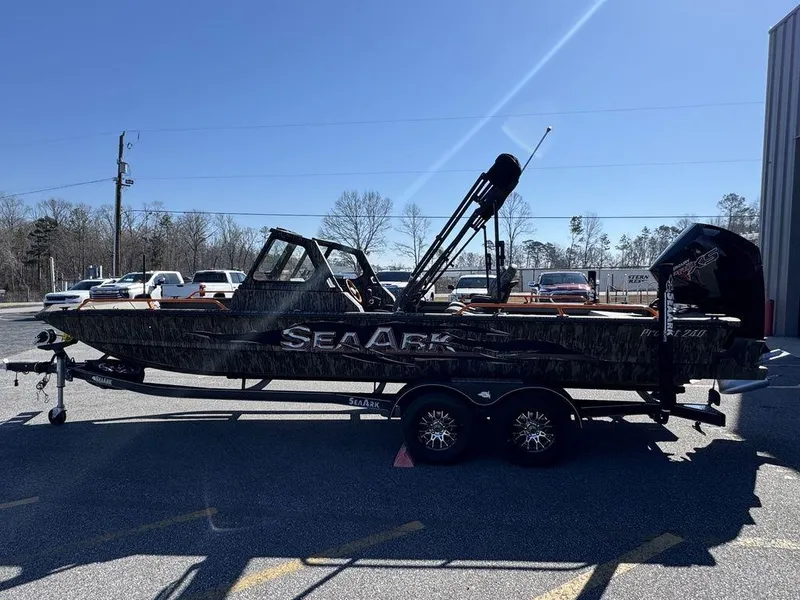 Slide: The Image of 2025 SeaArk ProCat 240 boat on trailer in parking lot, side view. - 6