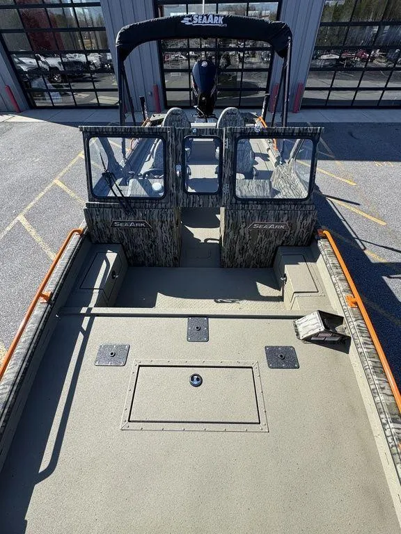 Slide: The Image of 2025 SeaArk ProCat 240 boat with spacious deck and dual consoles. - 8