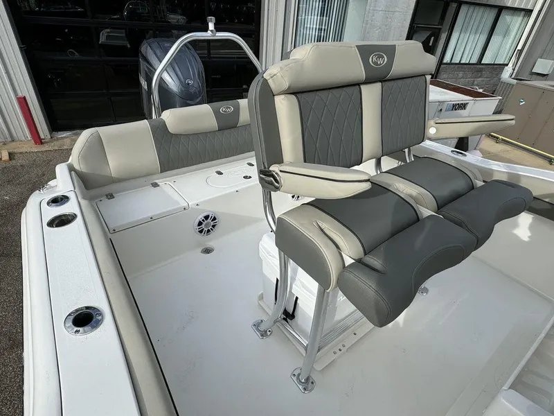 Slide: The Image of 2025 Key West 219fs boat interior with cushioned seating and modern design. - 13