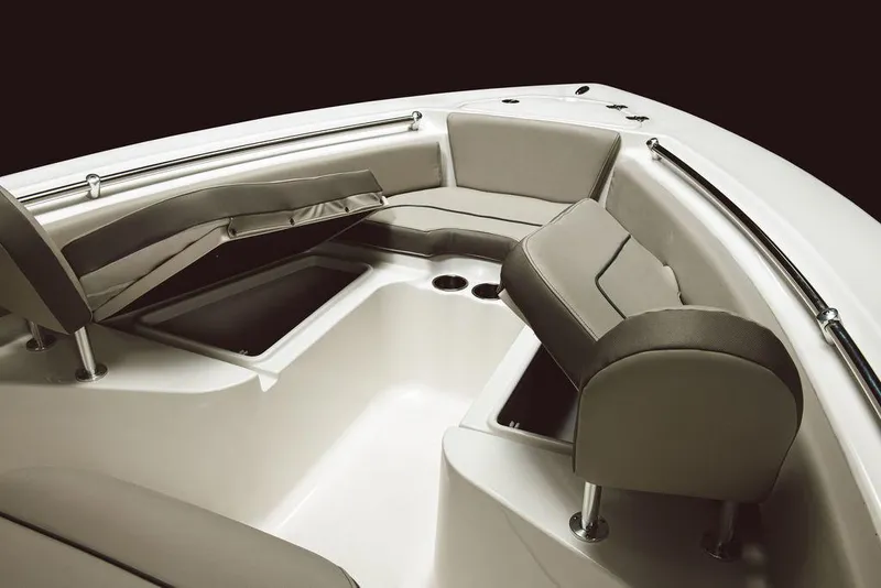 Slide: The Image of 2025 Key West 219fs boat interior with cushioned seating and storage compartments. - 21
