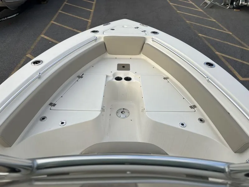 Slide: The Image of 2025 Key West 219fs boat interior, featuring spacious seating and storage compartments. - 8