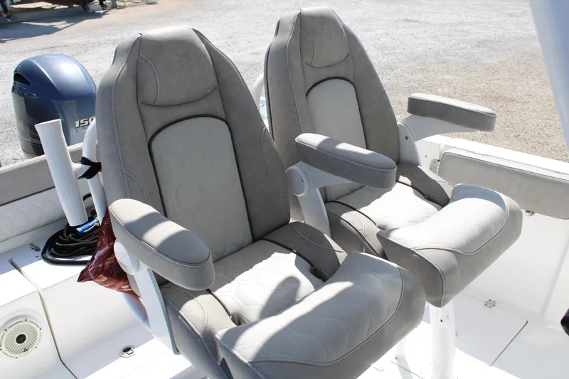 Slide: The Image of 2021 Sea Fox 268 Commander boat seats, featuring comfortable gray upholstery and armrests. - 12