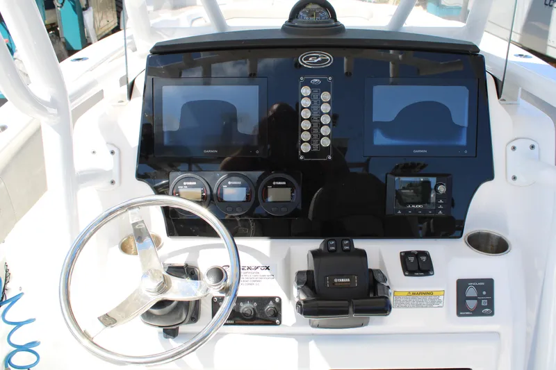 Slide: The Image of 2021 Sea Fox 268 Commander dashboard with dual displays and steering wheel. - 14