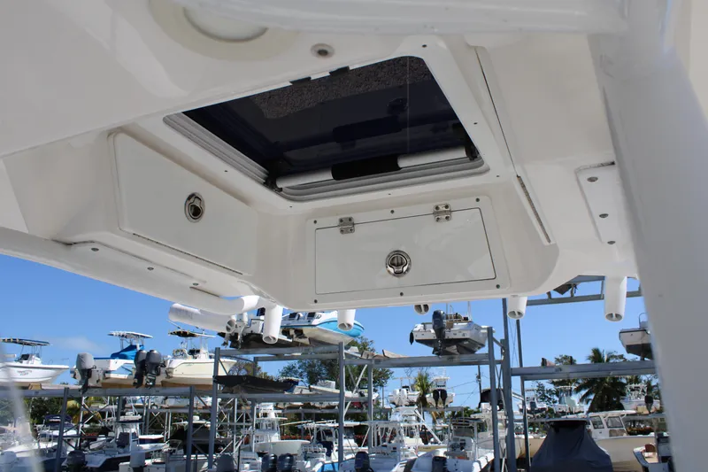 Slide: The Image of 2021 Sea Fox 268 Commander boat interior, featuring storage compartments and rod holders. - 17