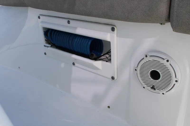 Slide: The Image of 2021 Sea Fox 268 Commander boat interior with hose storage and speaker. - 19
