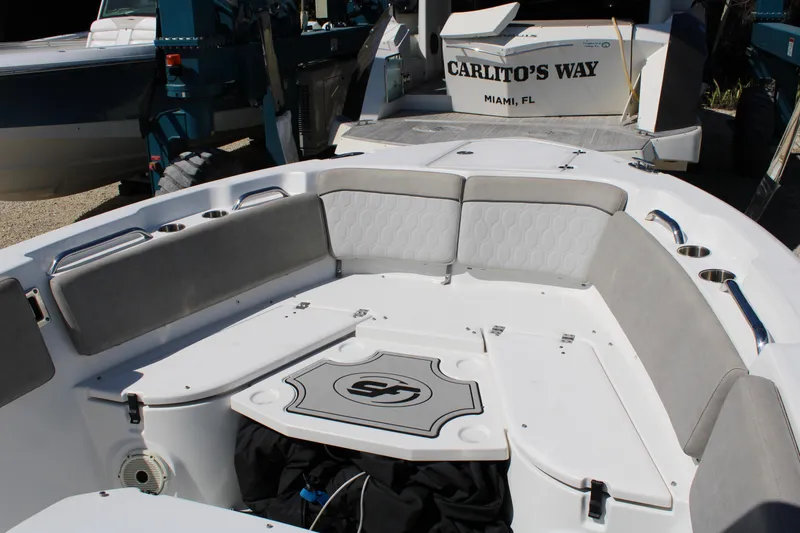 Slide: The Image of 2021 Sea Fox 268 Commander boat interior with cushioned seating and storage. - 21