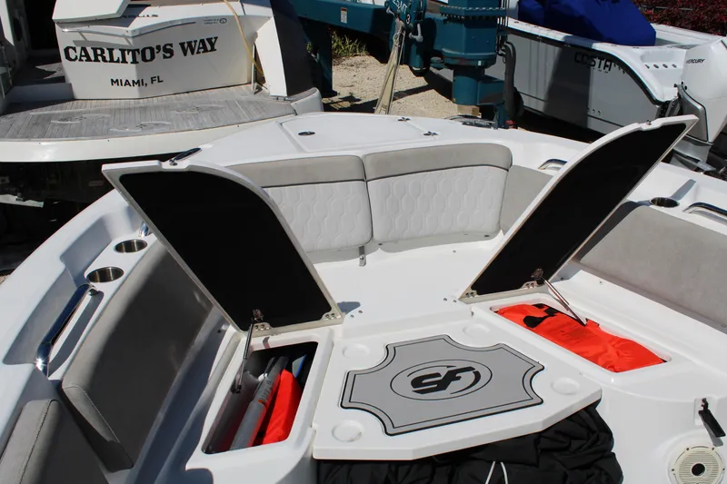 Slide: The Image of 2021 Sea Fox 268 Commander boat interior with open storage compartments and seating. - 22